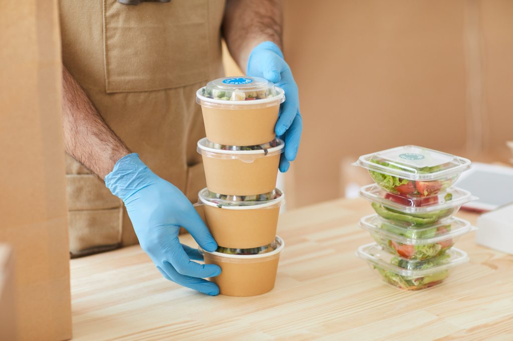 Worker Packaging Orders at Food Delivery